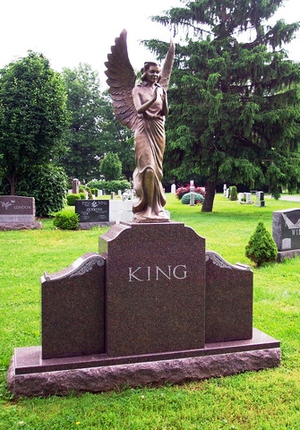 King Bronze Angel on Bronze Toned Granite
